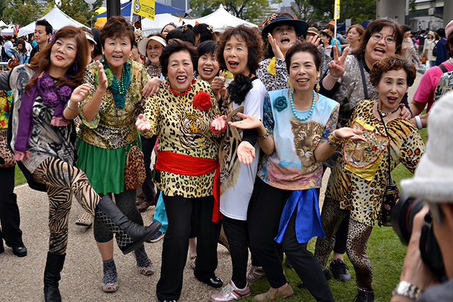 A group of older and vibrantly dressed women in Osaka, telling the world how it us. 
https://www.jpvisitor.com/middle-aged-women-in-osakaosaka-no-obachan-is-so-unique.html